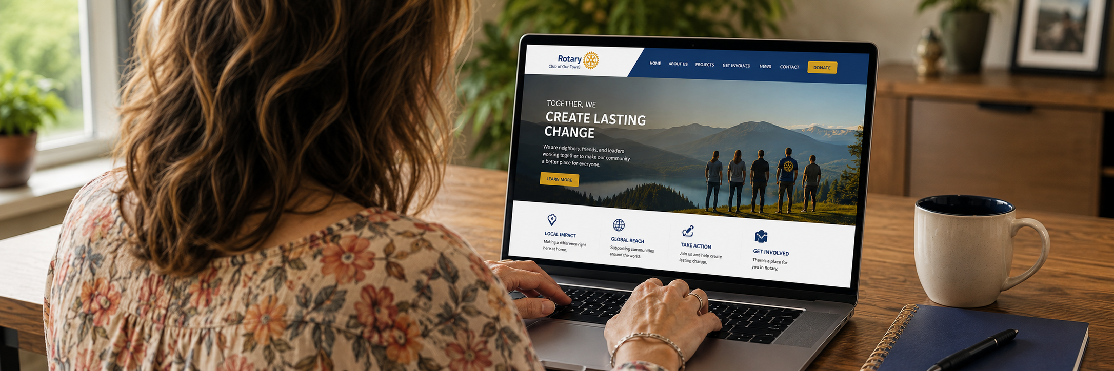 woman looking at a Rotary website on her laptop